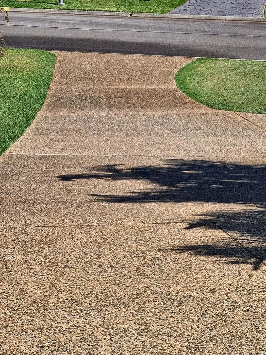 The same exposed aggregate driveway after pressure cleaning